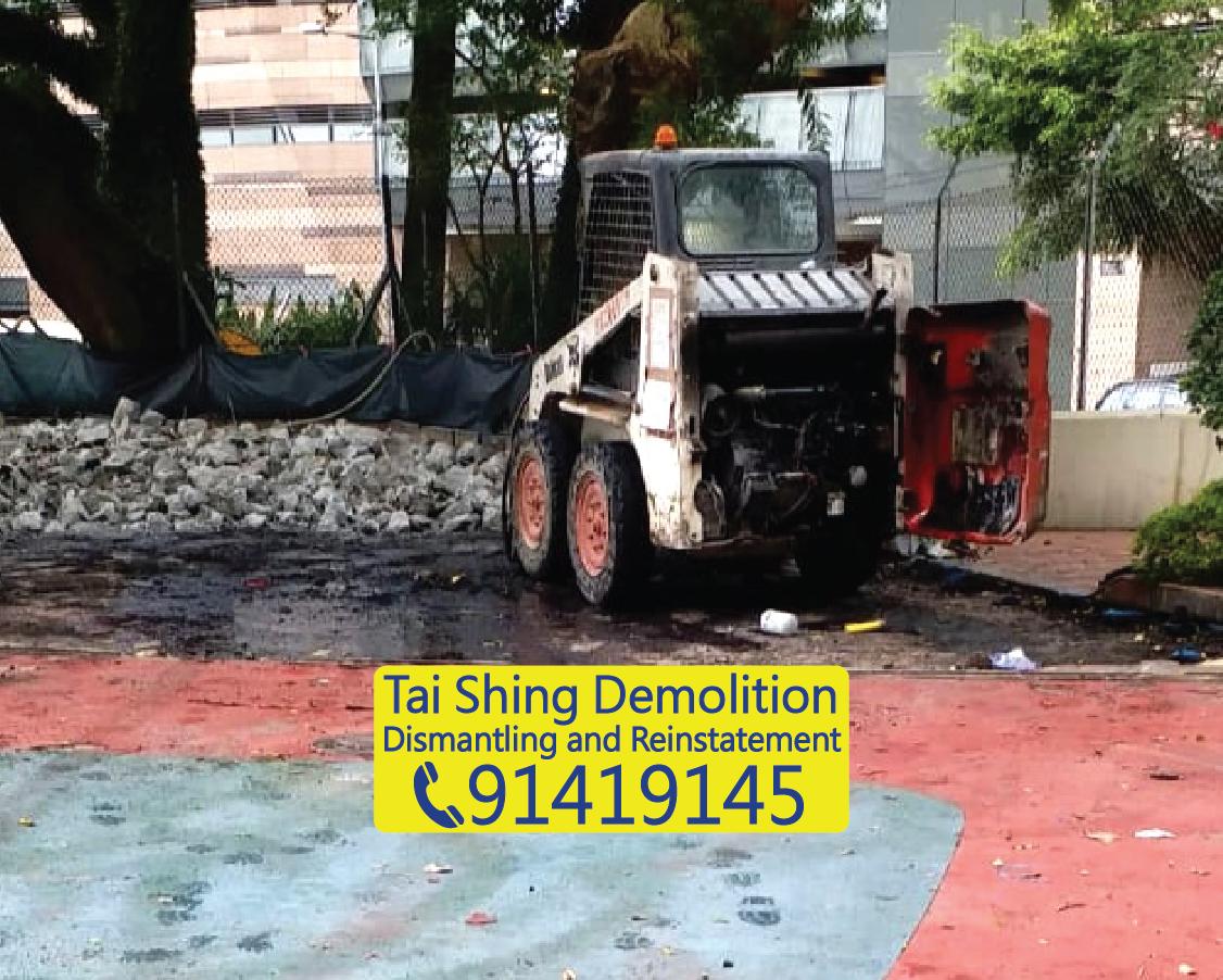 School playground concrete flooring demolition project, excavator clearing construction waste and concrete debris, campus renovation clearance